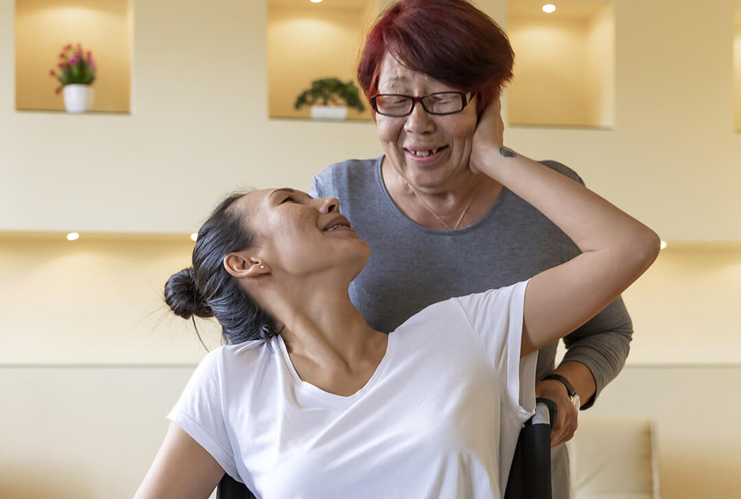 woman in wheelchair being pushed around