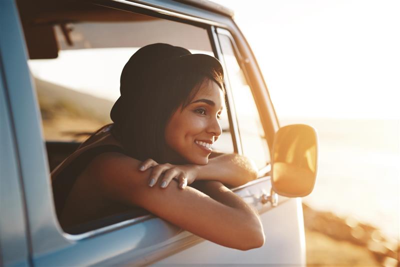 Woman looking out of car window